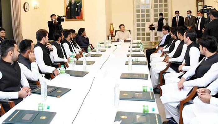Imran Khan during a meeting with the Pakistan cricket team at PM Office in Islamabad on September 22, 2021. — PID