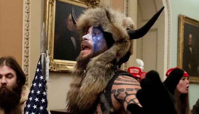 QAnon Shaman gained notoriety for the attack on the Capitol on January 6 after baring his chest and storming in while wearing a fur headpiece with horns.— AFP/File