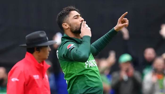 Mohammad Amir celebrates during a match on June 12, 2019. — AFP