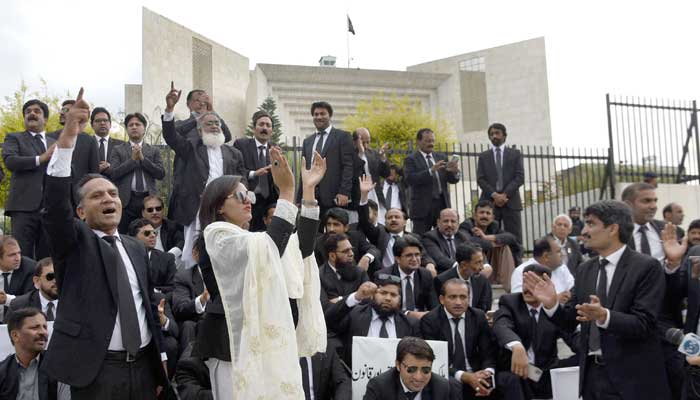 Lawyers shout slogans during protest outside Supreme Court in Islamabad on April 3, 2023. — Online