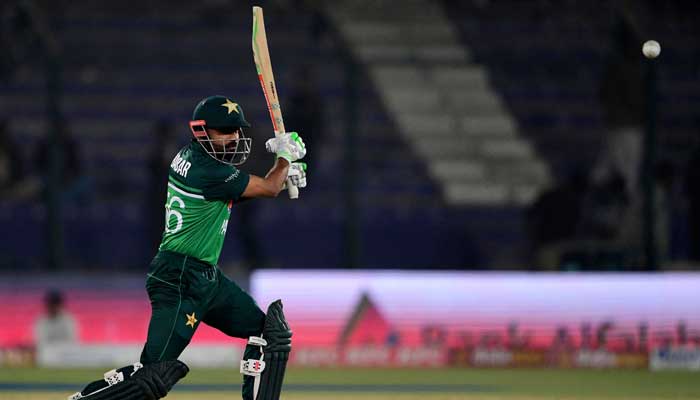Pakistans captain Babar Azam plays a shot during the first one-day international (ODI) cricket match between Pakistan and New Zealand at the National Stadium in Karachi on January 9, 2023. — AFP