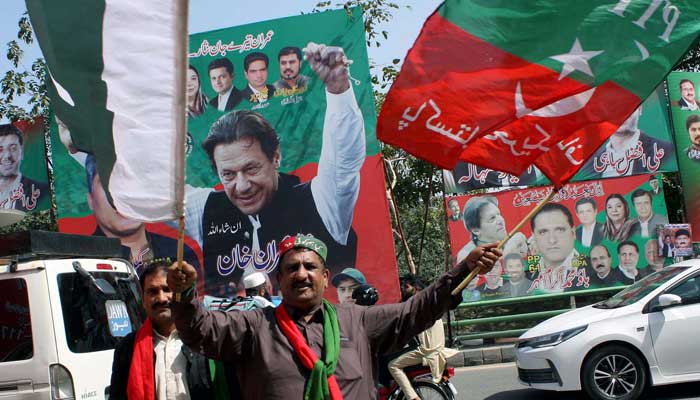 PTI workers celebrate Supreme Court decision on Punjab elections at Zaman Park in Lahore on April 4, 2023. — PPI