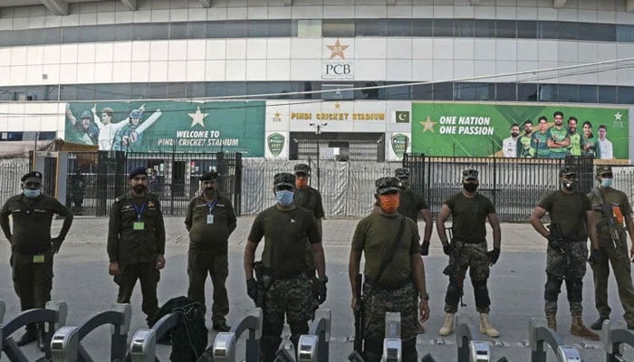Policemen stand guard outside the Rawalpindi Cricket Stadium in Rawalpindi on September 17, 2021. — AFP