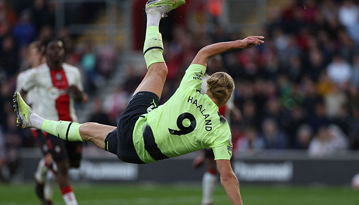 Manchester Citys Norwegian striker Erling Haaland scores their third goal with this overhead kick during the English Premier League football match between Southampton and Manchester City at St Marys Stadium in Southampton, southern England on April 8, 2023.AFP