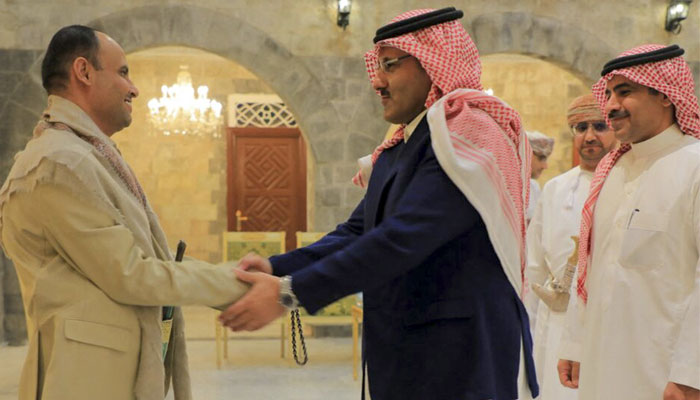 A handout picture released by the Huthi-affiliated branch of the Yemeni News Agency SABA on April 9, 2023, shows the Huthi group´s political leader Mahdi al-Mashat (L) welcoming the Saudi ambassador to Yemen Mohammed Al Jaber and a delegation in Sanaa.—AFP