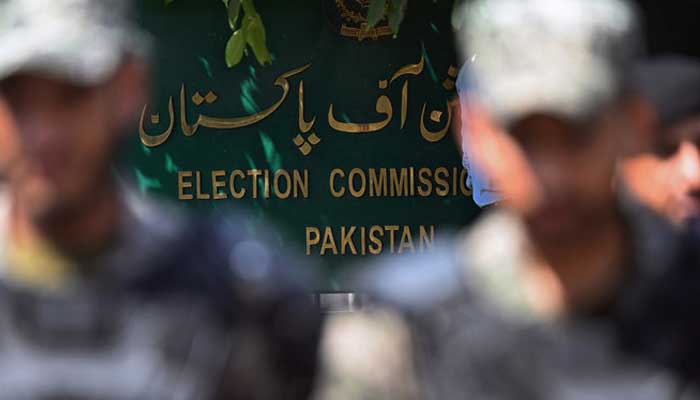 Paramilitary soldiers stand guard outside Pakistans election commission building in Islamabad on August 2, 2022. — AFP