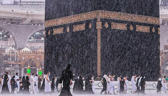 Muslim pilgrims circle the Kaaba and pray at the Grand Mosque amid heavy rain in this undated photo. — Facebook/jjhy.jeddawi//File