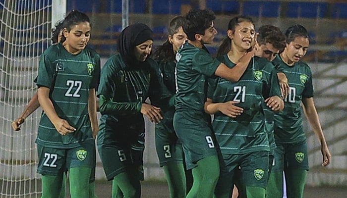 Pakistan womens team celebrates after scoring the winning goal against Tajikistan during the AFC Olympic Qualifiers, on April 11, 2023, in this still taken from a video. — Twitter/PFF