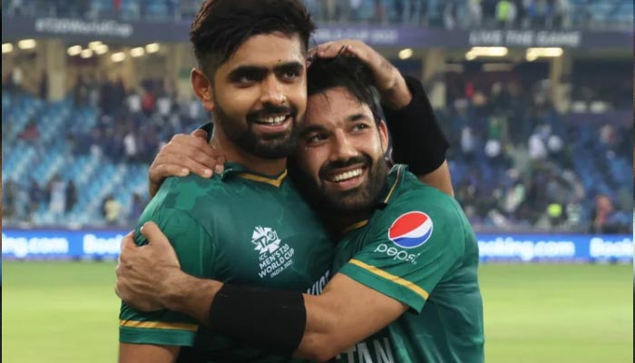 Pakistan captain Babar Azam (L) hugs his opening partner Mohammad Rizwan after the duo managed to defeat India in ICC Mens T20 World Cup 2021. — Twitter/ICC