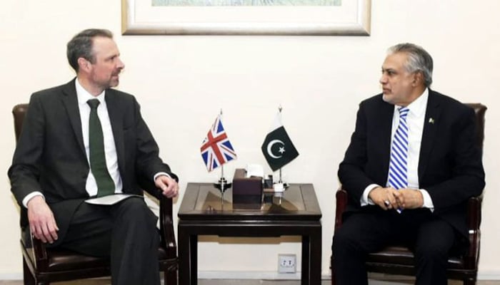 Acting British High Commissioner Andrew Dalgleish (left) calls on Finance Minister Ishaq Dar on April 12, 2023. — APP