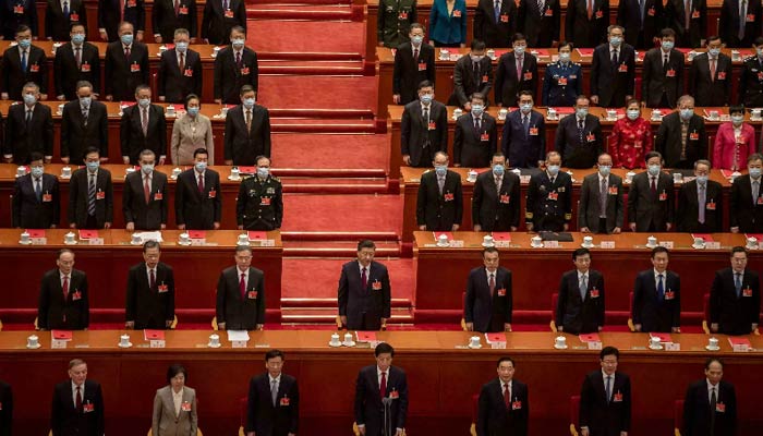 Members of Chinas Communist Party Central Committee stand during a meeting. — AFP/File