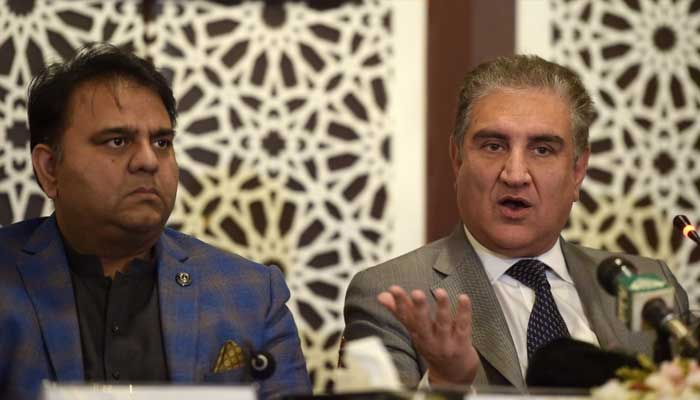 Pakistan Tehreek-e-Insaf (PTI) Vice Chairman Shah Mahmood Qureshi (R) and Senior Vice President Fawad Chaudhry are pictured during a press conference in Islamabad in this undated file photo. — AFP