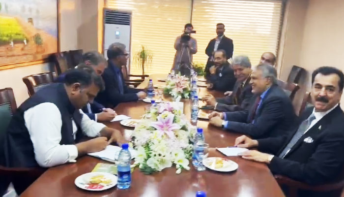 PTI (left) and PDM delegations during a meeting at Parliament House in Islamabad, on April 27, 2023, in this still taken from a video. — The News via Haider Sherazi