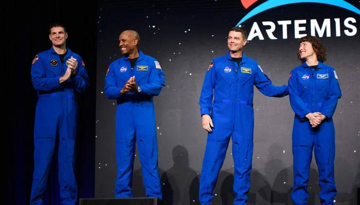 (L-R) Astronauts Jeremy Hansen, Victor Glover, Reid Wiseman and Christina Hammock Koch celebrate after being selected for the Artemis II mission who will venture around the Moon during a news conference held by NASA and CSA at Nasa Johnson Space Centers Ellington Field in Houston, Texas, on April 3, 2023. — AFP
