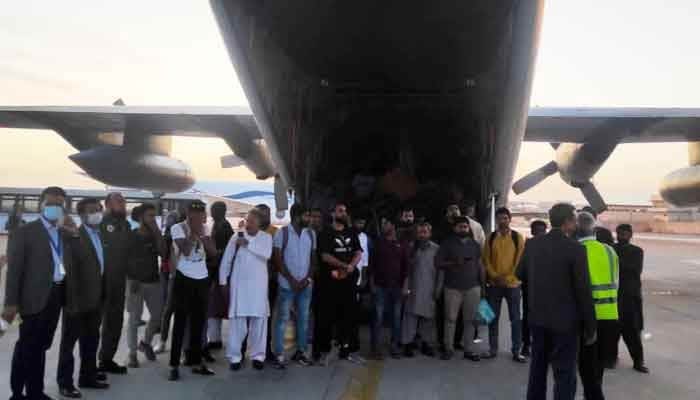 Pakistanis evacuated from Sudan stepping out of aircraft after reaching Karachi on April 29, 2023. — Twitter/@ForeignOfficePk