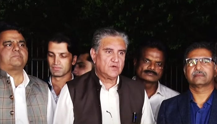 PTI Senior Vice Chairman Shah Mahmood Qureshi (centre) addressing a press conference alongside his party's delegation at the Parliament House in Islamabad, on May 3, 2023, in this still taken from a video. — YouTube/GeoNews