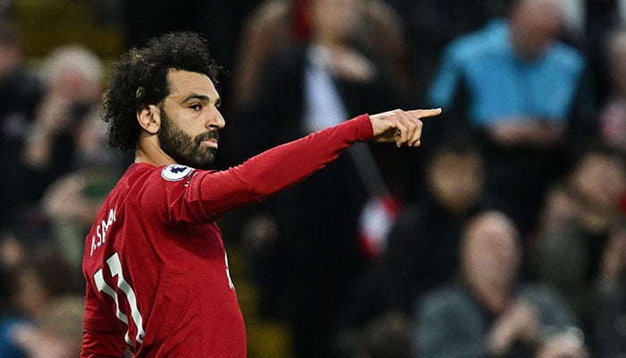 Liverpool´s Egyptian striker Mohamed Salah celebrates after shooting a penalty kick and scoring his team first goal during the English Premier League football match between Liverpool and Fulham at Anfield in Liverpool, north west England on May 3, 2023. AFP/File