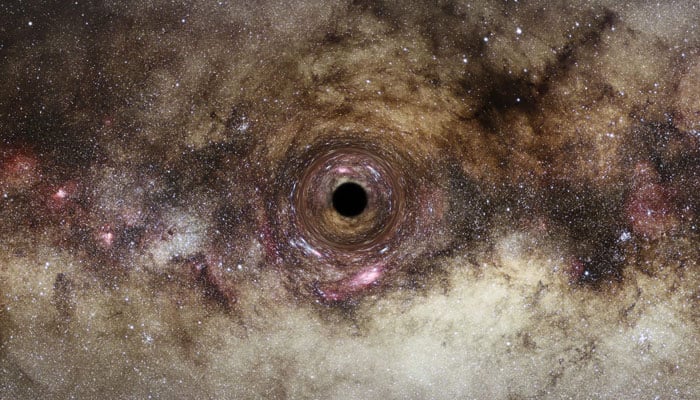 Bu resim, bir sanatçının Samanyolu galaksisindeki, yakınından geçen ışığı bozan bir kara delik izlenimini gösteriyor.  — AFP/Dosya
