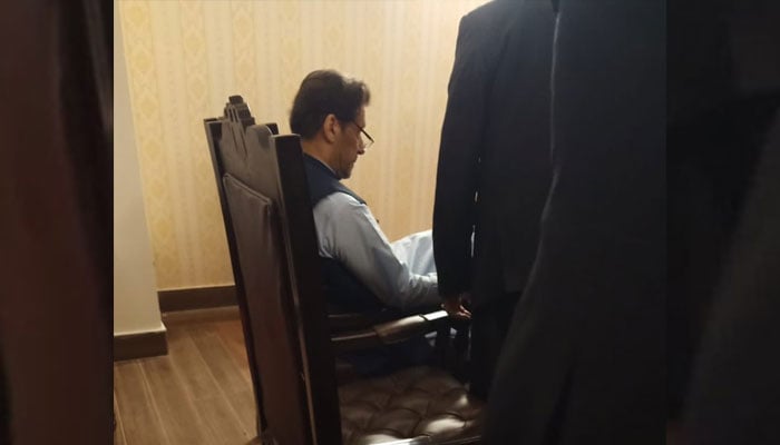 PTI Chairman Imran Khan can be seen sitting in a room which was given the status of a court as a “one-time dispensation” on May 10, 2023. — YouTube Screengrab via Geo News