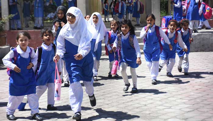Student leave for their homes after school timings end in Islamabad on May 10, 2023. — Online