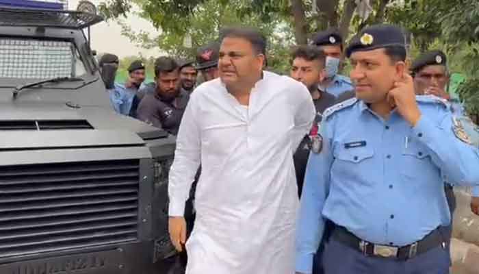 PTI Senior Vice President Fawad Chaudhry arrives at IHC under police custody. — Twitter/@PTIofficial