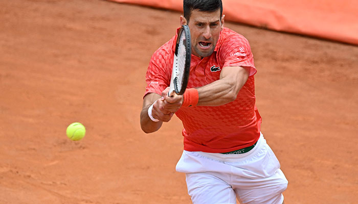 Serbias Novak Djokovic returns to Britain´s Cameron Norrie during their fourth round match of the Mens ATP Rome Open tennis tournament at Foro Italico in Rome on May 16, 2023. AFP