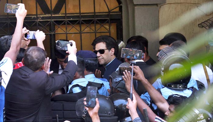 PTI Chairman Imran Khan arrives at Islamabad High Court amid tight security on May 12, 2023. — APP