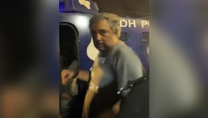 PTI leader Ali Zaidi is being escorted to jail by police officials in Karachi, on May 17, 2023, in this still taken from a video. — Twitter/AliZaidi