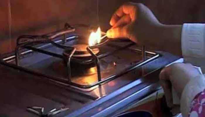 A woman is seen lighting the gas stove. TheNews/File