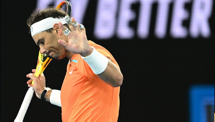 Spains Rafael Nadal reacts as he plays against USAs Mackenzie McDonald during their mens singles match on day three of the Australian Open tennis tournament in Melbourne on January 18, 2023. — AFP