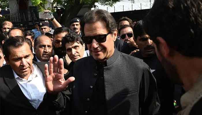 Former prime minister Imran Khan (C) gestures as he leaves after appearing before a court in Islamabad — AFP/File.