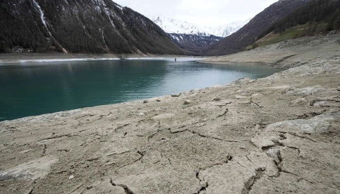The cracked dried bed surrounds the artificial Vernago lake, in Vernago, near the Val Senales glacier, northern Italy, on April 17, 2023. AFP/File