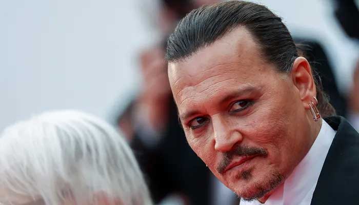 Johnny Depp seen strumming guitar in behind the scene video from latest film