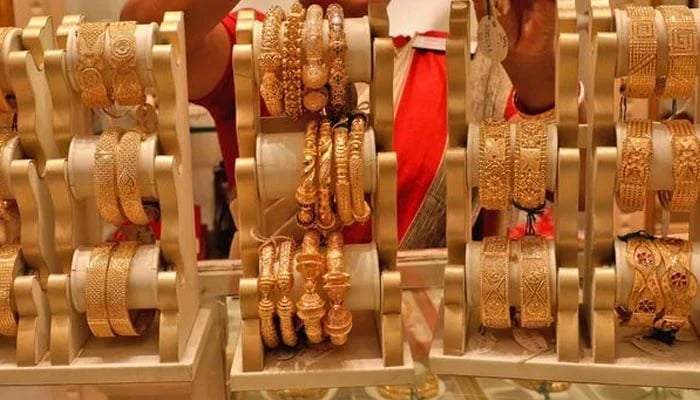 Gold bangles are displayed at a jewellery store in this undated file photo. — AFP