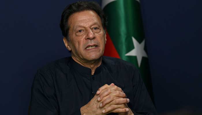 PTI Chairman Imran Khan speaks during an interview with AFP at his residence in Lahore on May 18, 2023. — AFP