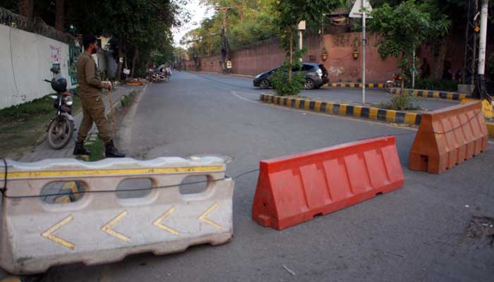 View of road going towards Zaman Park in Lahore seen blocked by police on Friday, May 19, 2023. — PPI