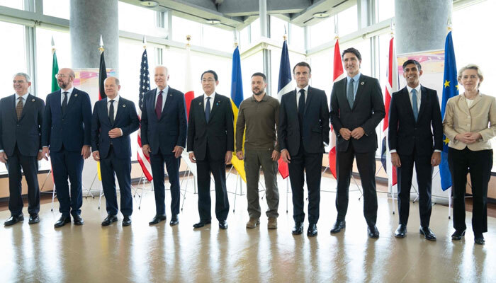 Ukraines President Volodymyr Zelensky (C) poses with G7 leaders for a family photo during the G7 Leaders Summit in Hiroshima on May 21, 2023. — AFP