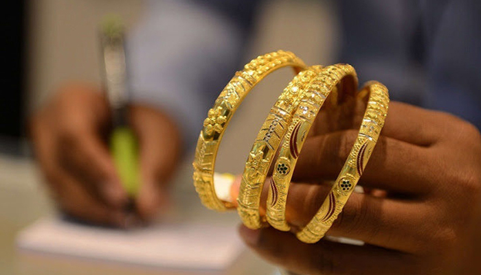 This undated file image shows a set of gold bangles. — AFP