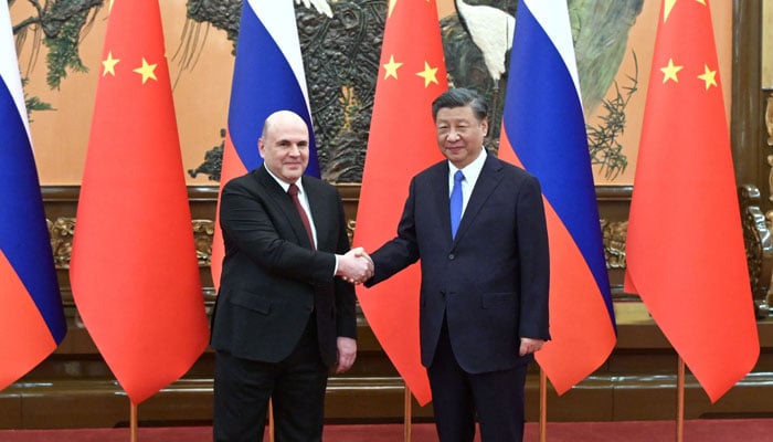 Russian Prime Minister Mikhail Mishustin meets with China´s President Xi Jinping in Beijing on May 24, 2023. — AFP