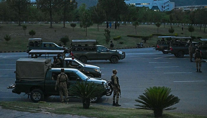 Army troops stand guard in the red zone after the arrest of former prime minister Imran Khan triggered violent protests by his supporters, in Islamabad on May 11, 2023. — AFP