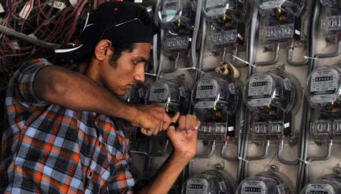 A technician from Karachi Electric , Pakistans largest citys power supply company, checks electricity meters at a residential building in Karachi, on May 13, 2010. — AFP