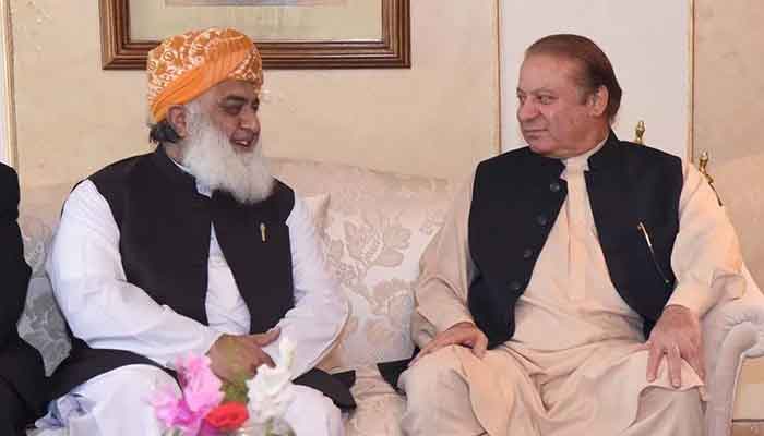 Maulana Fazlur Rehman (left) in meeting with Nawaz Sharif at Punjab House in this file photo. — APP