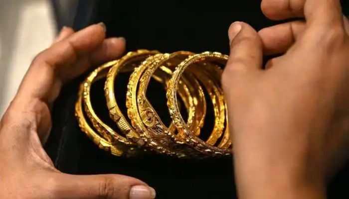 This undated file photo shows gold bangles. — AFP