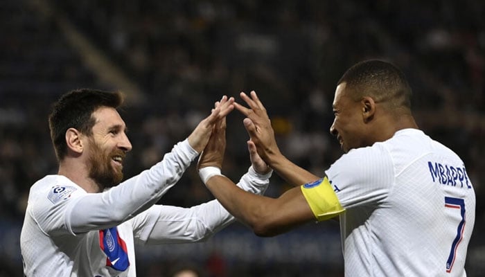 Lionel Messi celebrates with Kylian Mbappe after scoring for Paris Saint-Germain as they drew 1-1 in Strasbourg on Saturday to clinch the Ligue 1 title. AFP/File