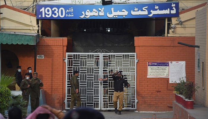 A policeman gestures at the entrance of the District Jail Lahore on March 20, 2021. — AFP