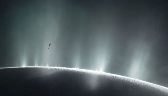 This handout illustration obtained April 13, 2017 courtesy of Nasa, shows Nasas Cassini spacecraft diving through the plume of Saturns moon Enceladus, in 2015. — AFP