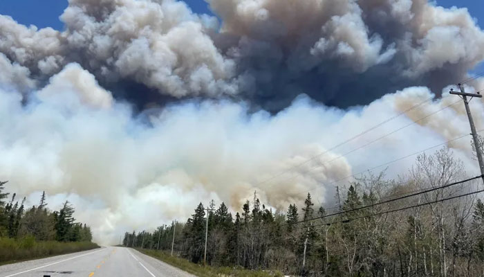 In this image, taken on May 28, 2023, smoke rises from a wildfire near Barrington Lake in Nova Scotia’s Shelburne County. — AFP