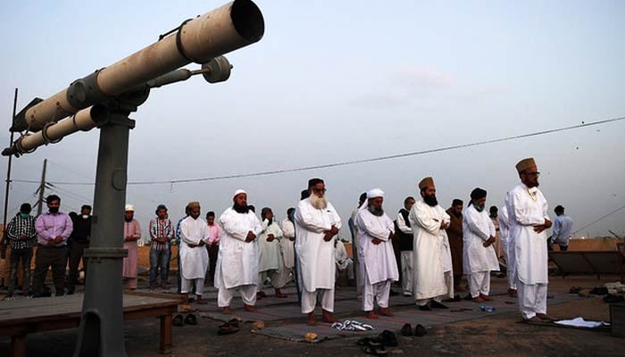Ramadan moon-sighting committee offers Magrib prayer in Karachi on April 23, 2020. — AFP