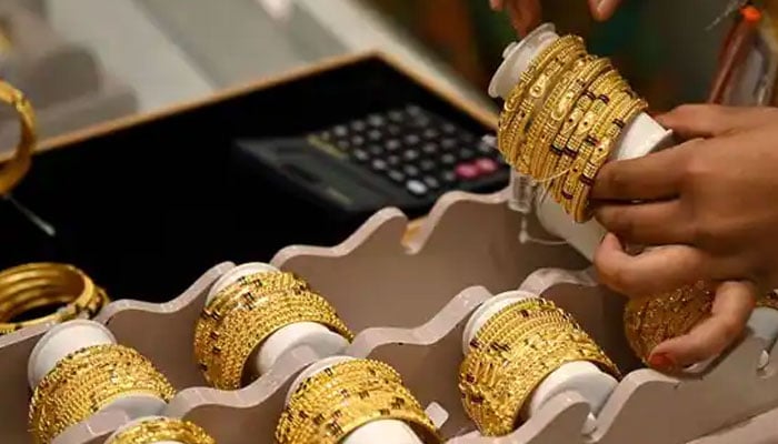 The picture shows gold bangles on a display in this undated video. — AFP/File