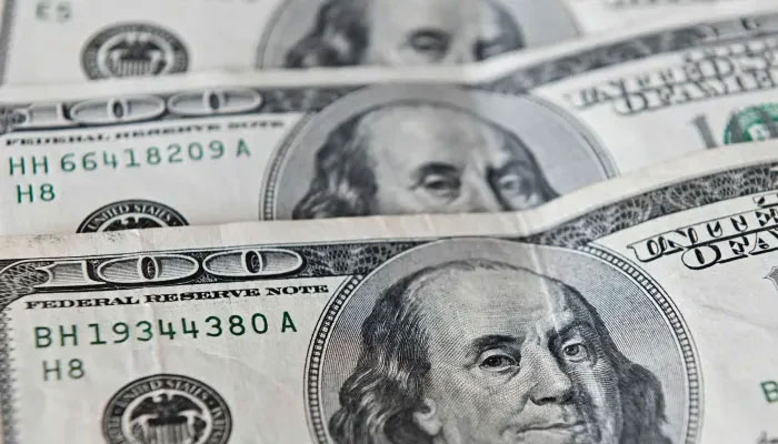 $100 bills. — AFP/File